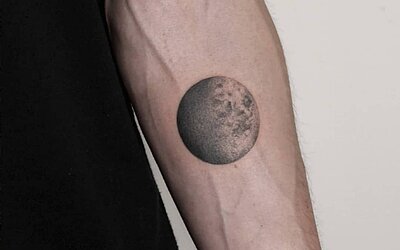 Moon motif as a tattoo on the forearm