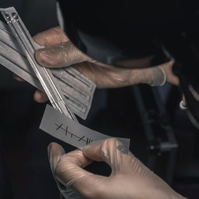 Hand Poking tool is held in the hand