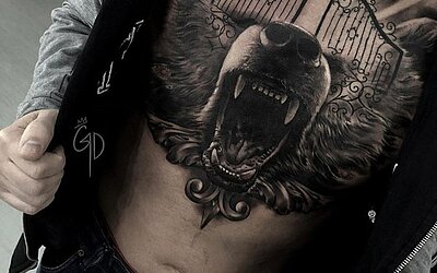 Bear head as a mash-up of realism and surrealism in black &amp; grey on the chest