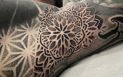 Mandala tattoo under the armpits 