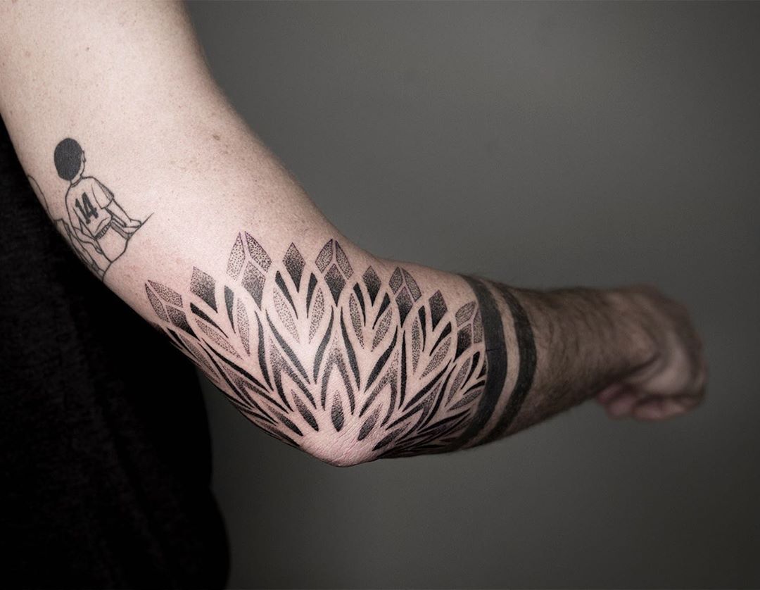 Sacred geometry dotwork mandala tattoo by Miah Waska